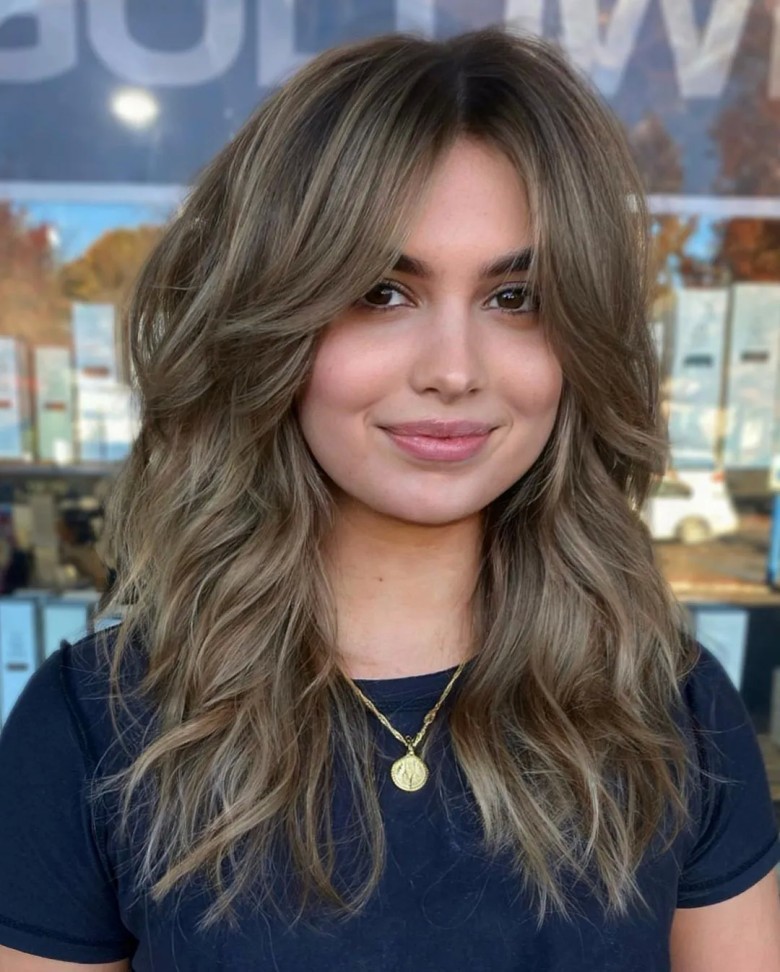 4. Wavy Hair with Curtain Bangs